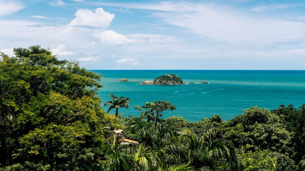sea, blue, green, and clouds in Quepos, Costa Rica by Vincent